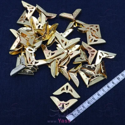 گوشه کیف فلزی طرحدار طلایی